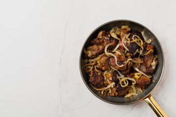 Fried chicken liver with onions.