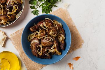 Fried chicken liver with onions.