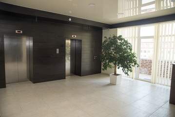 Two doors of elevators in modern business building.