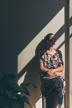 Portrait of a Young Woman at Home.