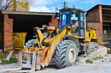 Wheel loader on a construction site. Diesel bulldozer with bucket