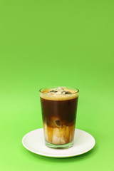 Iced coffee latte isolated on color