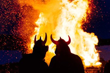 People at a bonfire at night