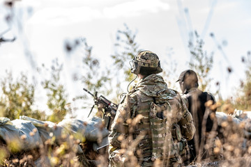 group of soldiers on the Outdoor on army exercises. war, army, technology and people concept