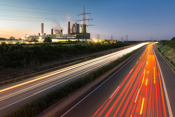 Long exposure sunset over German highway along power plant , Germany