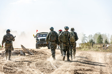 group of soldiers on the Outdoor on army exercises. war, army, technology and people concept