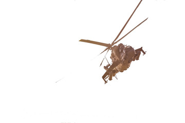 military helicopter flying during exercise performing a military demonstration