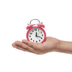 alarm clock in hand on white