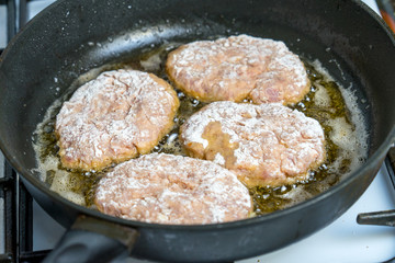 Minced cutlets are fried in a pan in boiling oil.
