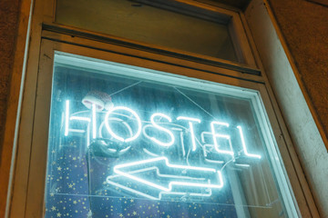 Hostel Sign with Santa Claus's Hat.