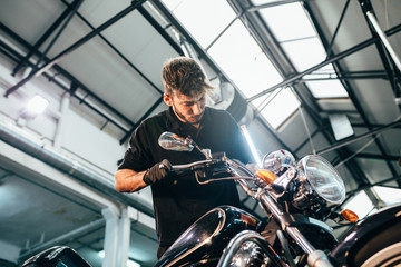 Mechanic working in the motorbike workshop