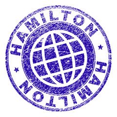 HAMILTON stamp imprint with grunge texture. Blue vector rubber seal print of HAMILTON text with grunge texture. Seal has words placed by circle and globe symbol.