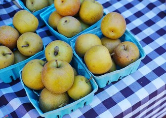 Baskets of Asian pears (Pyrus pyrifolia) at the farmers market in the fall