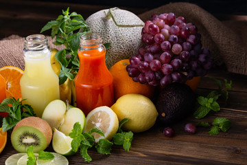Healthy foods with juices placed and group of fruits