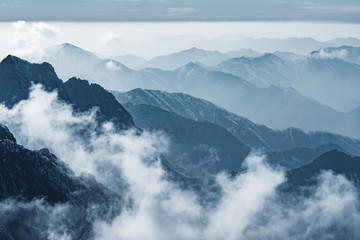 Clouds by the mountain peaks of Huangshan National park. China