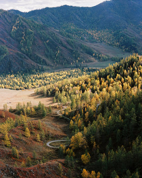 A view from above on a valley where there is a road