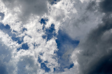 A light and dark sky on a rainy day.