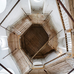 old retro wooden spiral staircase in the ancient bell tower of the Orthodox Church in Russia....