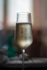 Misted glass of champagne with drops