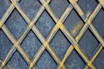 Iron mesh fence with gold in the Victorian style. Background. Texture
