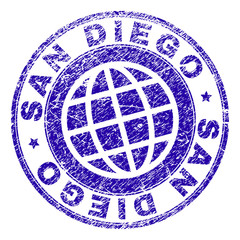 SAN DIEGO stamp print with distress style. Blue vector rubber seal print of SAN DIEGO text with dust texture. Seal has words placed by circle and planet symbol.