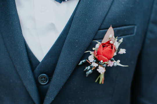Man wearing a floral buttonhole at a wedding