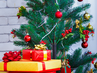 Christmas scene with tree gifts and colorful gifts box.