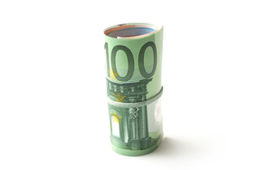 closeup of banknotes roll of one hundred euros money on white background