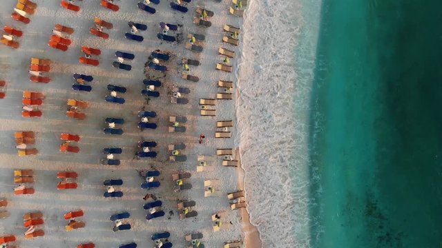 Sunrise at Marble Beach Thassos or Thasos Island Greece aerial video footage of tourists on the beach shot using a drone