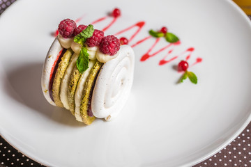 dessert. cake roll with raspberries and pistachios