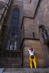 Fototapeta na wymiar Girl near the German Church with protest poses