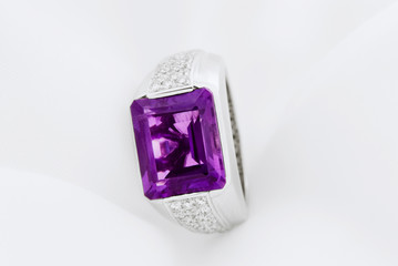 White Gold Ring With Amethyst And Diamonds On Soft White Background