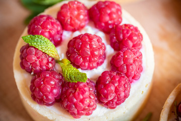 raspberry cake with cream cheese, mint on crumbly dough. Cake with raspberries