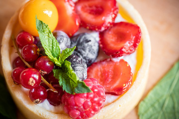 raspberry cake with cream cheese, mint on crumbly dough. Cake with raspberries