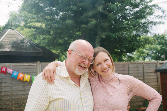 Father with his grown up daughter.