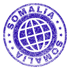 SOMALIA stamp imprint with grunge style. Blue vector rubber seal imprint of SOMALIA text with grunge texture. Seal has words arranged by circle and planet symbol.
