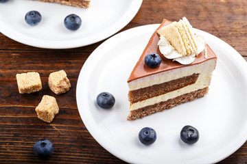 Cheesecake with blueberries on a wooden background