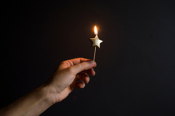 burning star-shaped candle
