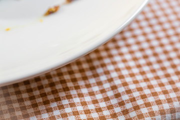 corner checkered tablecloth on the table