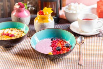 Porridge of muesli with fruit. Fresh fruit in porridge. Muesli with fruits. Muesli with fruit puree.