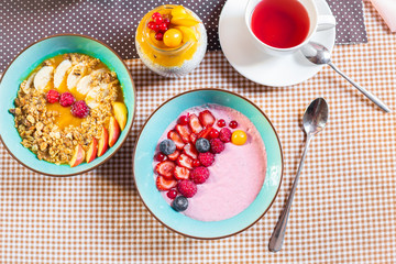 Porridge of muesli with fruit. Fresh fruit in porridge. Muesli with fruits. Muesli with fruit puree.