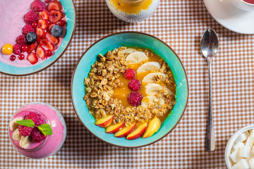 Porridge of muesli with fruit. Fresh fruit in porridge. Muesli with fruits. Muesli with fruit puree.