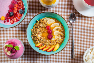 Porridge of muesli with fruit. Fresh fruit in porridge. Muesli with fruits. Muesli with fruit puree.