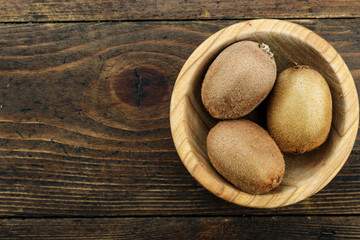   kiwi in a wooden plate