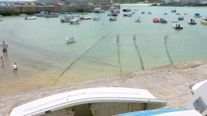 Boats, the beach, and harbour in St Ives, Cornwall.