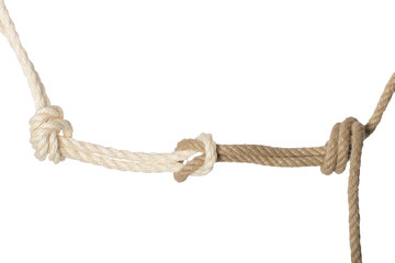 Close-up of node or knot from a white and brown rope isolated on a white background. Navy and angler knot.