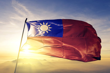 Taiwan taiwanese flag textile cloth fabric waving on the top sunrise mist fog