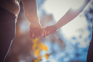 Couple holding hands together