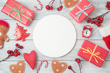 Christmas holiday background with gift boxes and decorations on wooden table