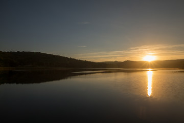 Sunset in the ruidera lagoons with the golden sky